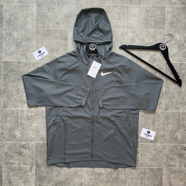 NIKE ESSENTIALS JACKET - STONE GREY