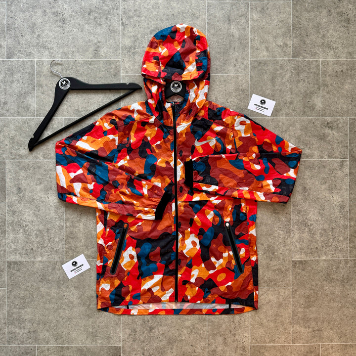 NIKE ‘JUST DO IT’ CAMO WINDRUNNER - SUNSET ORANGE